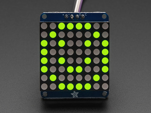 Adafruit Small 1.2" 8x8 Green LED Matrix w/I2C Backpack assembled and powered on. A yellow-green graphic smiley is displayed.