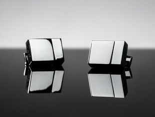 Two metal cufflinks shaped like USB drives