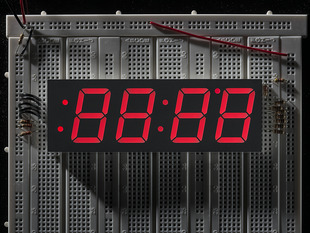 Huge red 7-segment clock display with all segments lit