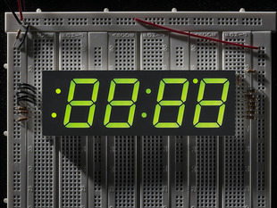 Huge green 7-segment clock display with all segments lit