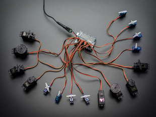 Top down view of a Adafruit 16-Channel 12-bit PWM/Servo Shield - I2C interface connected to 16 servos. 