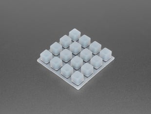 Angled shot of white silicone elastomer 4x4 button keypad.