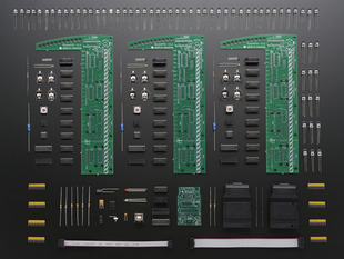 Layed-out collection of three pack kit components - PCB and loose parts.