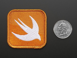 Square shaped embroidered badge of the stylized bird Swift logo in white on orange background. 