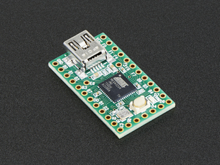 Angled shot of Teensy 2.0 dev board with ATmega32u4.