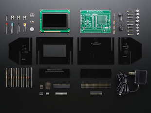 Unassembled kit shot with PCB, enclosure and loose parts.