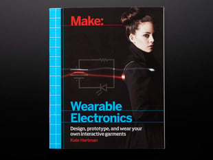 Front cover of Make: Wearable Electronics by Kate Hartman. Design, prototype, and wear your own interactive garments. Photograph of a young white woman with dark hair in a black high-collared robe.