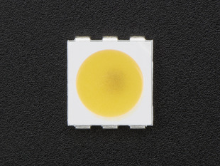 Top down view of a 5050 Warm White LED w/ Integrated Driver Chip. 