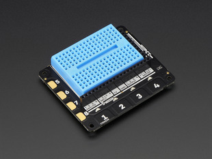 Angled shot of Pimoroni Explorer HAT Pro for Raspberry Pi with a blue mini breadboard.