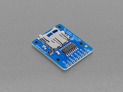 Angled shot of blue, rectangle microSD breakout board.