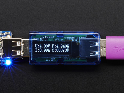 Top view of USB Voltage Meter with OLED Display that reads various measurements.
