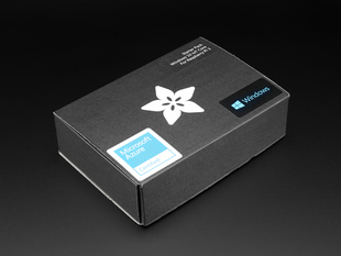 Angled shot of a black box with the white Adafruit star-flower logo.