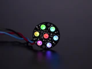 NeoPixel Jewel - 7 x 5050 RGB LED wired to Trinket, lit up rainbow and white