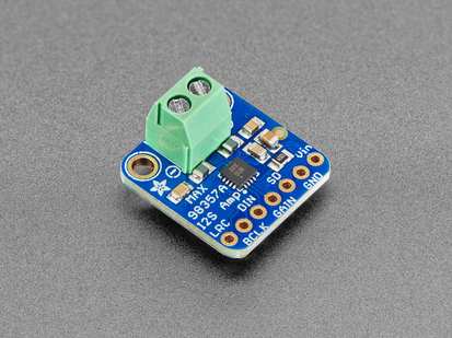 Angled shot of blue, square-shaped, amplifier breakout with a pre-soldered terminal block.