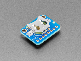 Angled shot of the battery cell slot on a Adafruit DS3231 Precision RTC Breakout. 