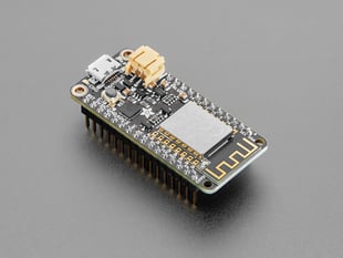 Angled shot of rectangular microcontroller with headers.