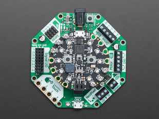 Top down view of a Adafruit CRICKIT for Circuit Playground Express with a circular board connected. 