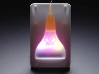 Assembled Pimoroni Mood Light glowing a rainbow gradient.