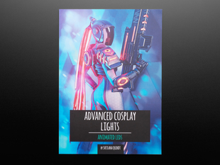 Front cover of Advanced Cosplay Lights - Animated LEDs - by Svetlana Quindt @KamuiCosplay. A helmeted female cosplayer wields a 3D-printed prop gun with LEDs and wears a prop ponytail with LED-lit electronic dreads.