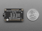 Top Down Back Shot of the Adafruit I2S Stereo Decoder - UDA1334A Breakout next to a U.S. Quarter for Scale.