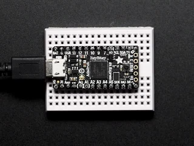 Adafruit ItsyBitsy M4 Express featuring ATSAMD51 connected to a small breadboard. 