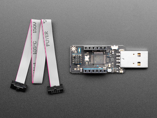 Particle Debugger next to a cable. 