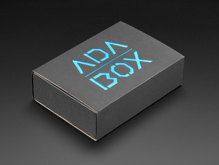 Angled shot of a black box with Blue "ADABOX" texted logo.