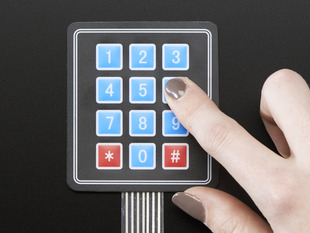 Finger pressing one key of 3x4 keypad