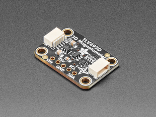 Angled shot of a Adafruit TLV493D Triple-Axis Magnetometer. 