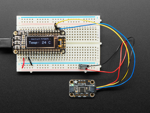 Adafruit PCT2075 Temperature Sensor with STEMMA QT / Qwiic cable plugged into a Feather showing the temperature