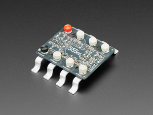 Angled shot of a "Three Fives" 555SE Discrete Timer SMT Soldering Kit.