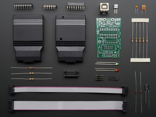 Layed-out collection of kit components - PCB and loose parts.