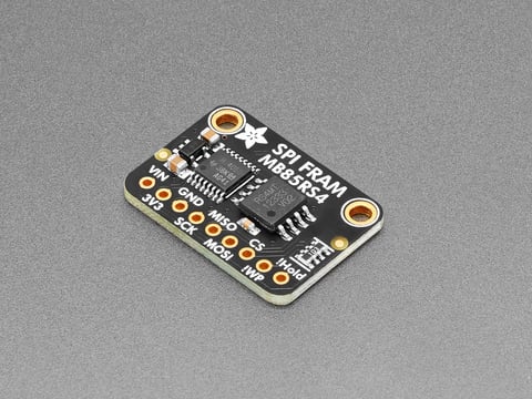 Angled shot of black, rectangle-shaped FRAM breakout board.