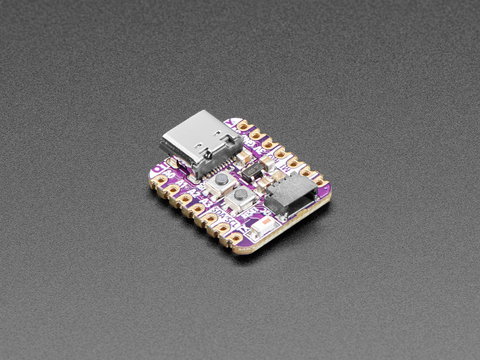 Angled shot of an Adafruit QT Py ESP32-C3 WiFi Dev Board with STEMMA QT.