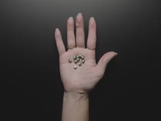 Video of a large inductive charger, lighting up ten blue wireless LEDs placed in a white person's palm.