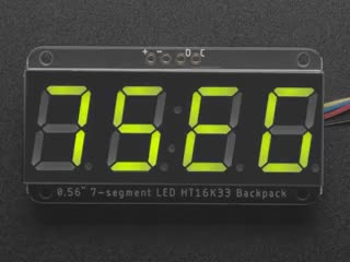 Video of green 7-segment clock display lit up.