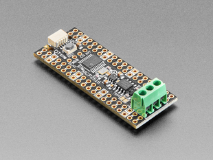 Angled shot of long skinny CAN Bus microcontroller with terminal blocks.