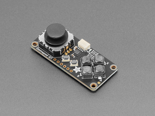 Angled shot of small rectangular gamepad PCB with thumbstick.