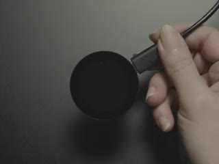 Video of a finger tapping a round touchscreen with cherry animations.