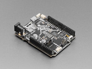 Angled shot of black, credit-card-sized development board.