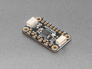 Angled shot of black, rectangular ADC breakout board.