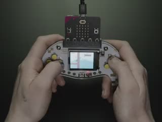 Video of a pair of white hands playing a DIY gaming controller.