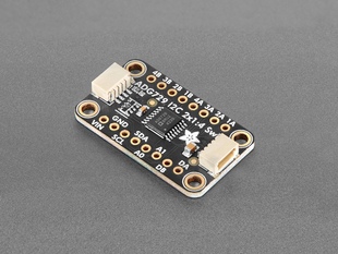 Angled shot of black, rectangular I2C breakout board.