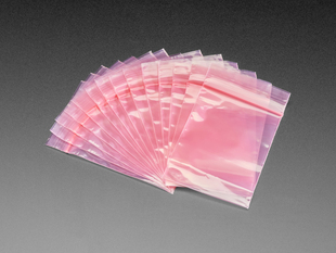 Angled shot of a group of pink antistatic bags fanned out.