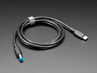 Coiled USB to DC barrel jack cable.