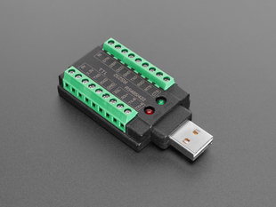 Angled shot of black and green, rectangular, USB-to-RS232 adapter.