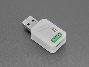 Angled shot of USB key in white plastic enclosure.