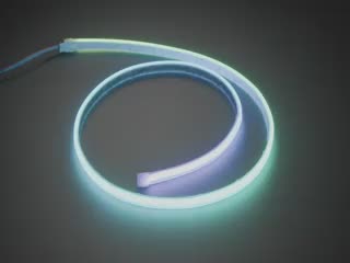 Video of LED strip in a spiral emitting rainbow colors in a gradient.