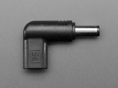 Overhead shot of barrel-jack-to-USB-C-socket right angle adapter, showing 12V.