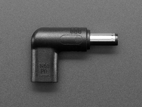 Overhead shot of barrel-jack-to-USB-C-socket right angle adapter, showing 19.5V.